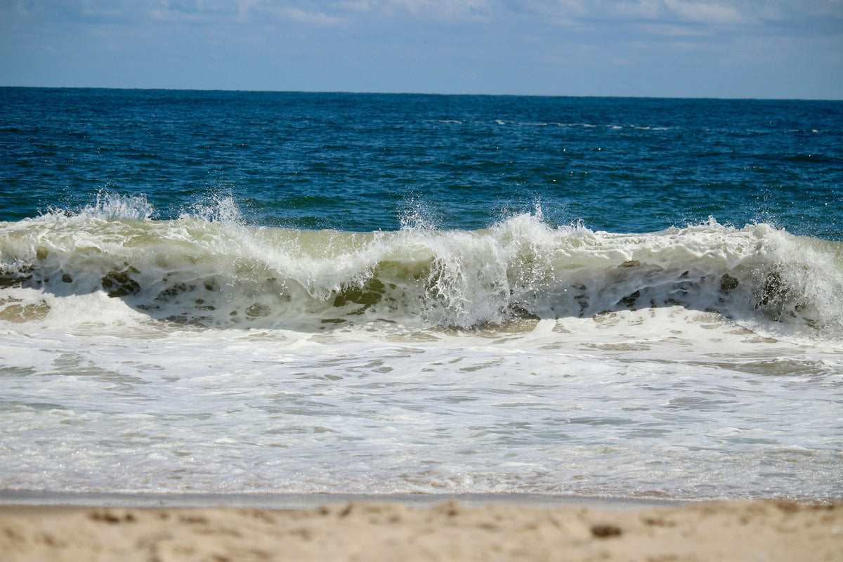 Ocean waves breaking on the sandy shore at Rehoboth Beach, Delaware