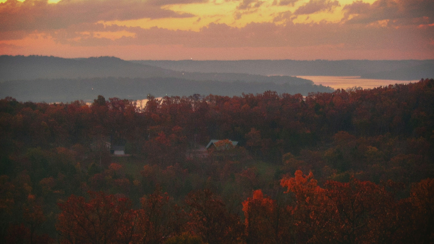 Autumn forest and lake shoreline at sunset near Branson in the Missouri Ozarks
