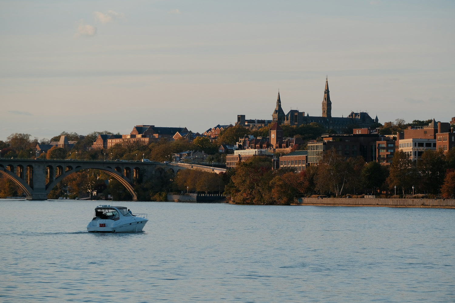 A boat on the Potomac River below the Georgetown waterfront and Key Bridge in Washington, D.C.